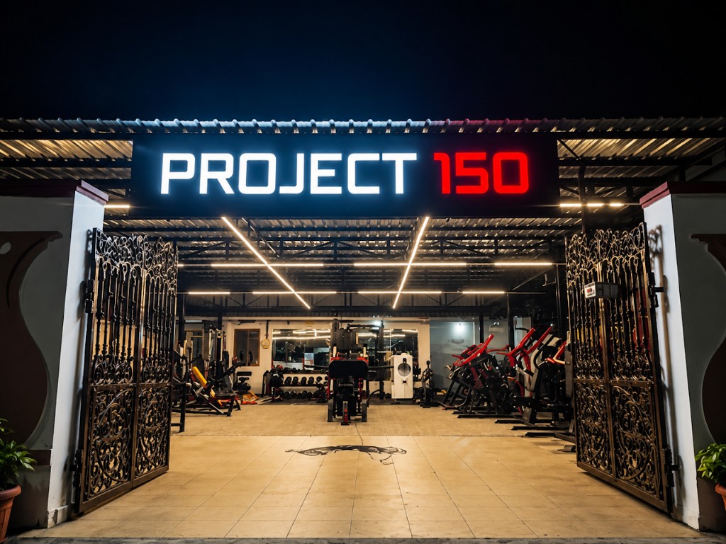Project 150 gym at night, lights on, gates open, no membership desk